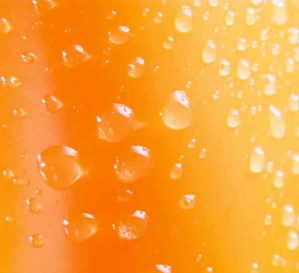 Powierzchnia pomarańczowy z kropli wody — Zdjęcie stockowe