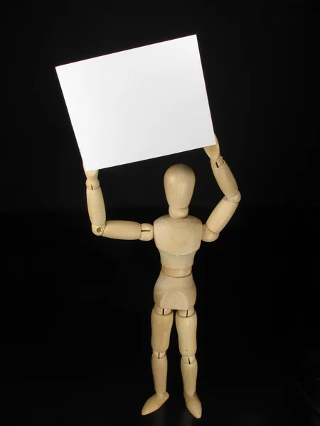 Humanoid white poster holding it over his head — Stock Photo, Image