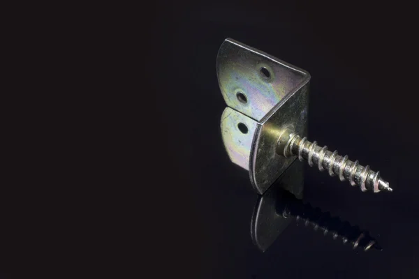 Metal bracket with screw — Stock Photo, Image
