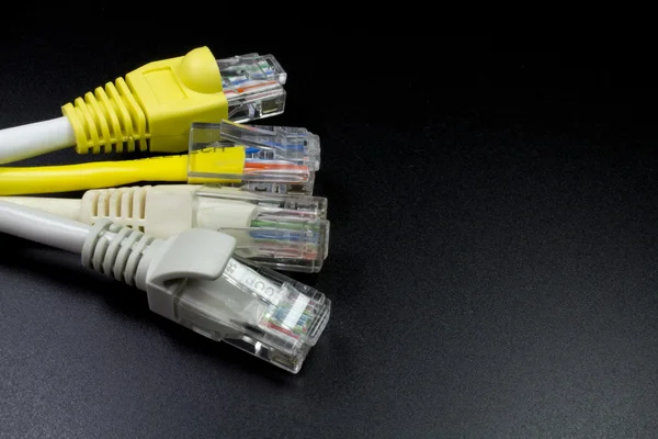 Macro several RJ45 network connector on black background — Stock Photo, Image