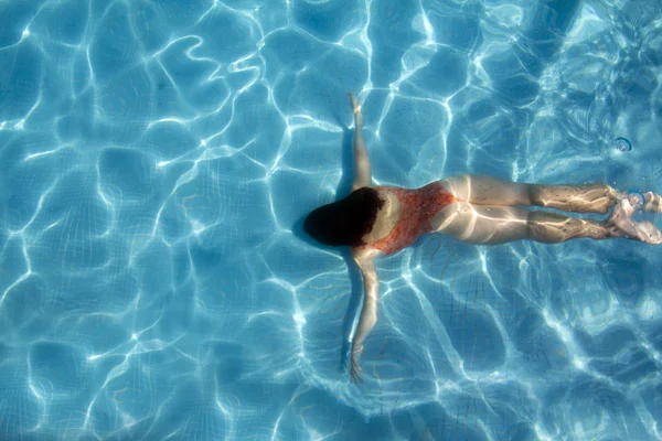 stock image Girl blue water diving