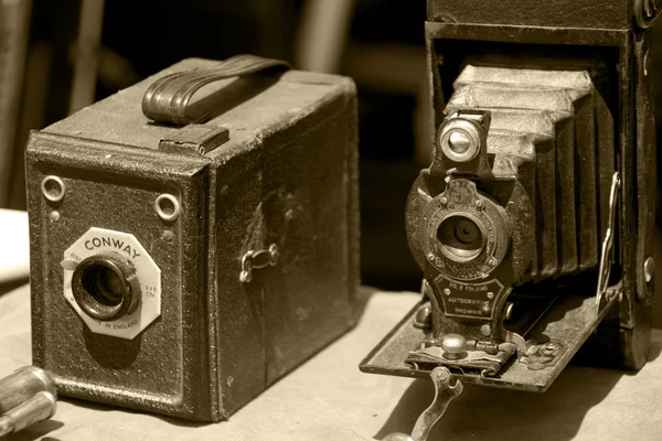 stock image Two very old photo camera in sepia