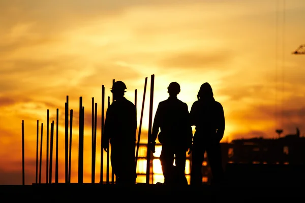 stock image Builder at sunset