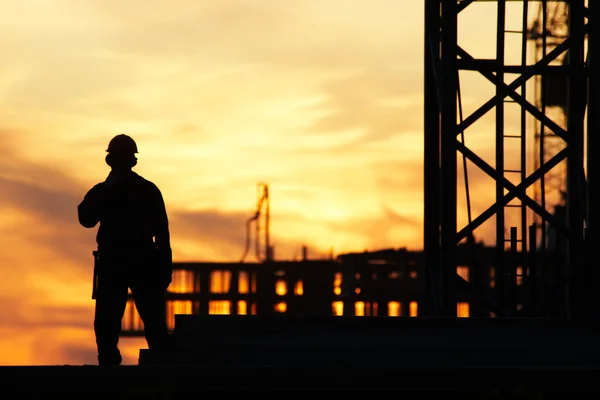 Builder at sunset — Stock Photo, Image