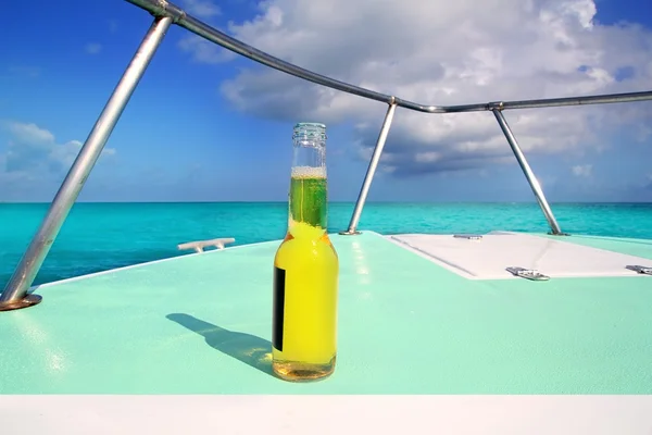 Beer on Caribbean boat bow deck turquoise sea — Stock Photo, Image