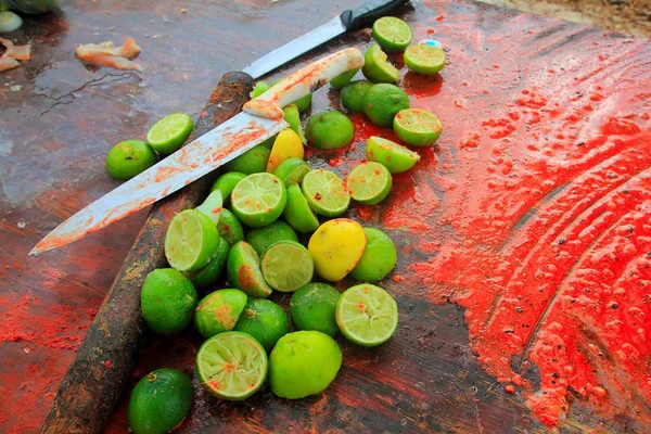Achiote knifes and lemons for achiote tikinchick sauce — Stock Photo, Image