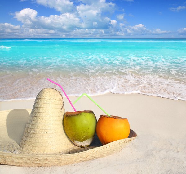 Coconuts in Caribbean beach on mexico sombrero hat