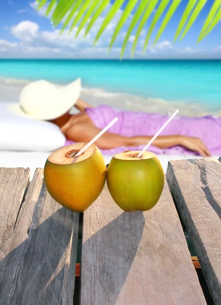 Coconuts woman sun tanning topical beach — Stock Photo, Image