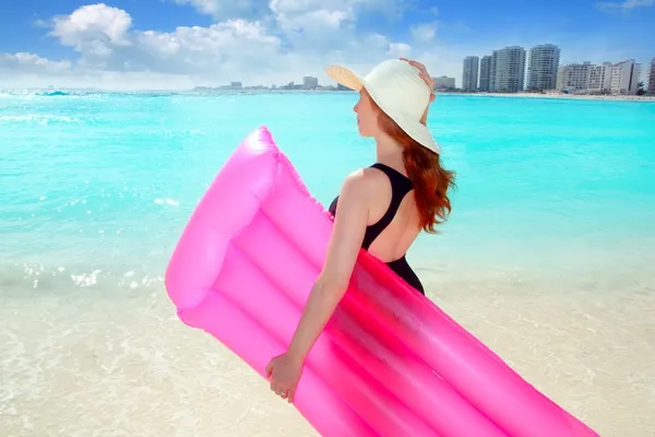 Floating lounge pink girl in caribbean tropical beach — Stock Photo, Image