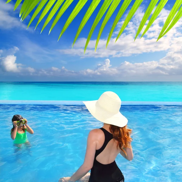 Blue swimming pool caribbean view mother daughter — Stock Photo, Image