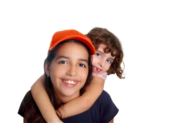 Beautiful Latin teen hispanic girl with little friend smiling — Stock Photo, Image