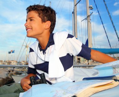 Boy teen sailorsitting on marina boat chart map clipart