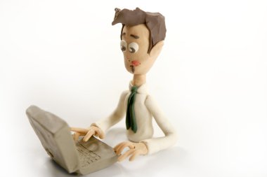 Plasticine handmade businessman with laptop clipart