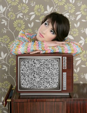 Retro pensive woman on vintage wooden tv 60s clipart