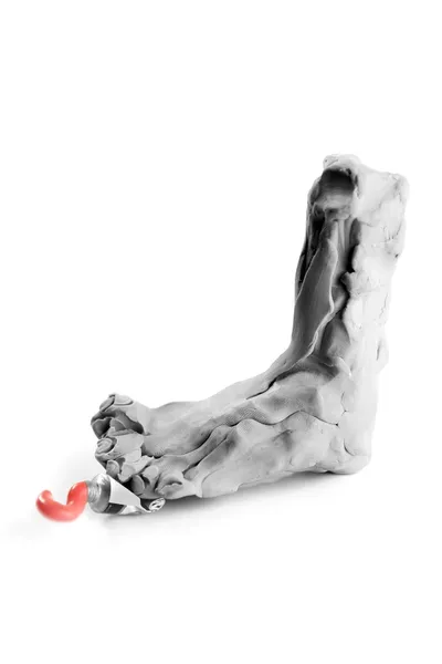 Toy plasticine statue replica feet with oil paint — Stock Photo, Image