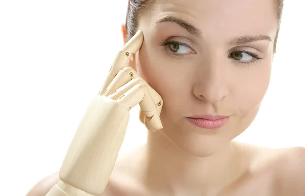 Woman portrait thinking with mannequin hand — Stock Photo, Image
