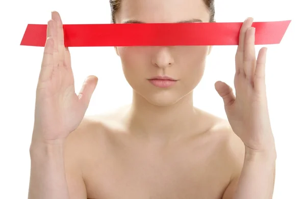 Beautiful cosmetic woman, red tape in eyes — Stock Photo, Image
