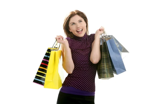 Mujer Shopaholic con bolsas de colores sobre blanco —  Fotos de Stock