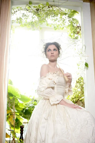 Victorian beautiful woman, white dress at home — Stock Photo, Image