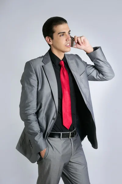 Empresario con traje gris hablando celular —  Fotos de Stock