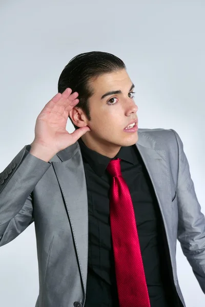 Empresario con la mano en la oreja como signo de sordera — Foto de Stock