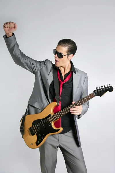 Üzletember zenész játszik eszköz öltöny — Stock Fotó