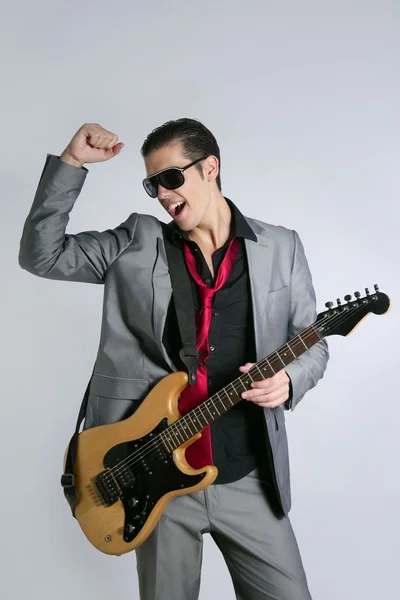 Hombre de negocios músico tocando instrumento con traje — Foto de Stock