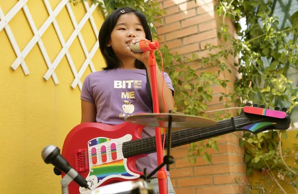 Live concert at home little girl playing — Stock Photo, Image