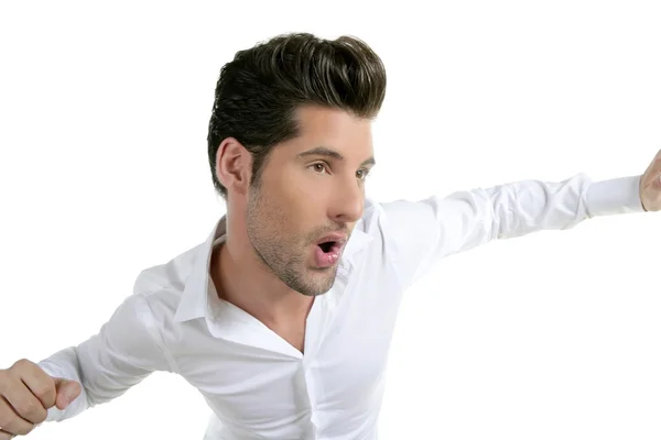 Смешной жест танцующий молодой мужчина над белым — стоковое фото