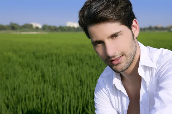 Young man outdoor happy in green meadow — Stock Photo, Image