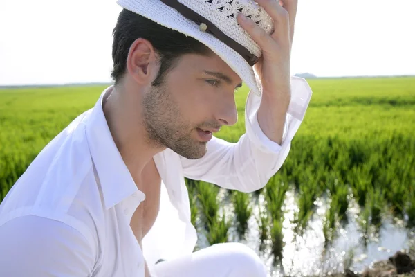 Mediterranean man portrait white hat inmeadow — Stock Photo, Image