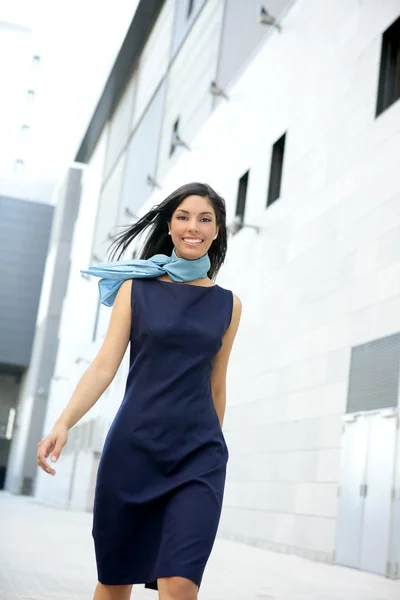 Beautiful stewardess walking to convention center — Stock Photo, Image