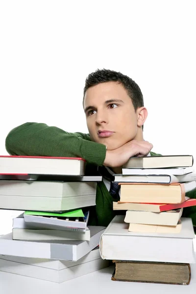 Jovem estudante infeliz com livros empilhados — Fotografia de Stock