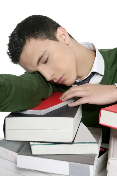 Niño estudiante durmiendo sobre apilar libros sobre escritorio —  Fotos de Stock