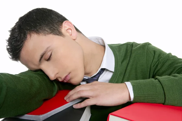 Boy student sleeping over stack books over desk — Stock Photo, Image