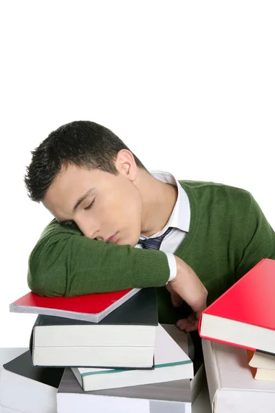 Menino estudante dormindo sobre livros pilha sobre mesa — Fotografia de Stock