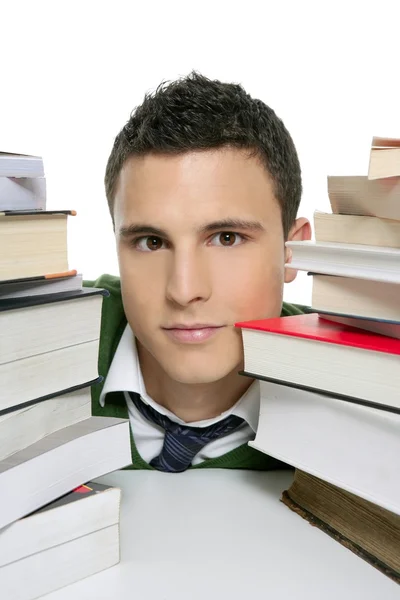 Jonge ongelukkig student met gestapelde boeken — Stockfoto