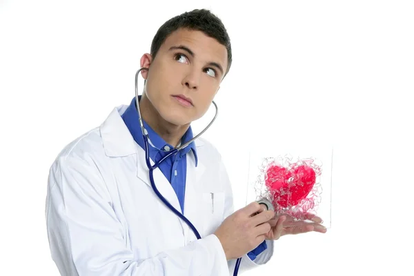 Doctor test a red heart health, young man — Stock Photo, Image