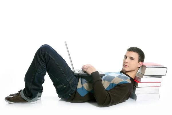 Student boy lying on floor, books and computer — Stock Photo, Image