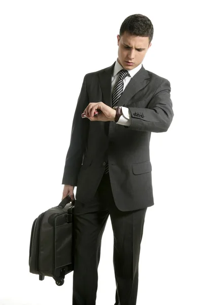 Uomo d'affari guardare il suo orologio con borsa — Foto Stock