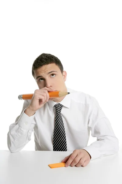 Young businessman student thinking with pencil — Stock Photo, Image