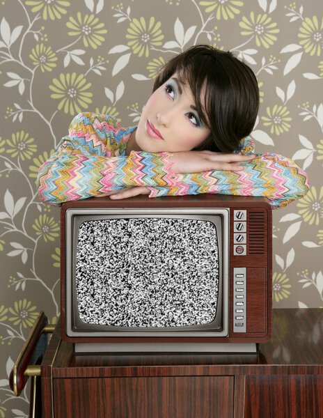 Retro pensive woman on vintage wooden tv 60s Stock Image