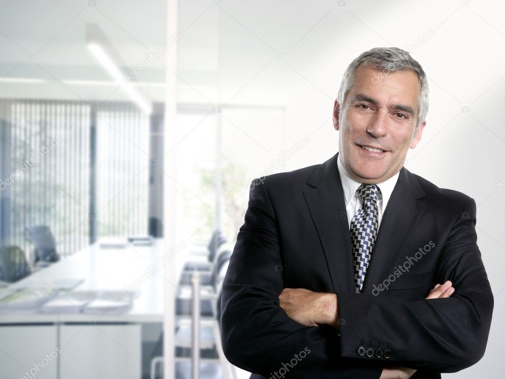 Gray hair businessman interior white office