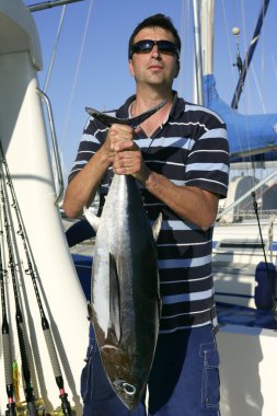 Big game fisherman with saltwater tuna clipart