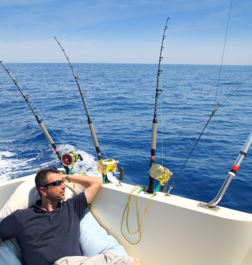 Sailor man fishing resting in boat summer vacation clipart