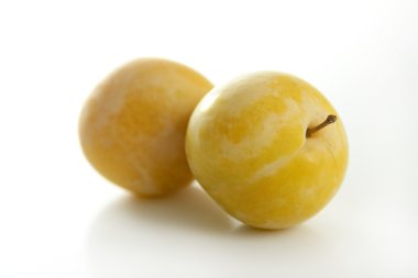 Yellow Mirabelles on white background clipart