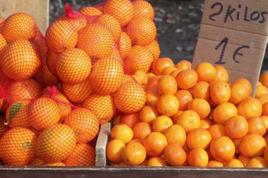 Tengerine oranges on mediterranean market clipart