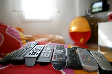 Many remote control for only one house clipart