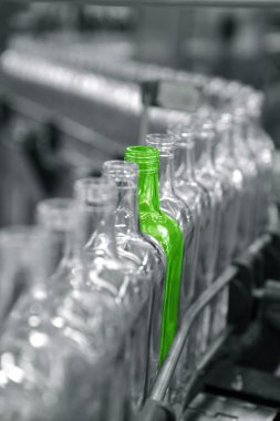 Different unique green bottle in factory line clipart