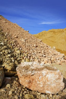 Sand quarry mounds of varied sands color clipart